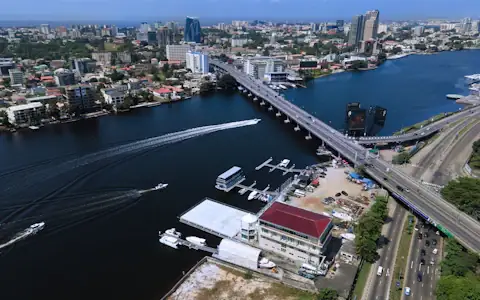 Aerial view of Victoria Island, Lagos, with lagoon boats and the city skyline