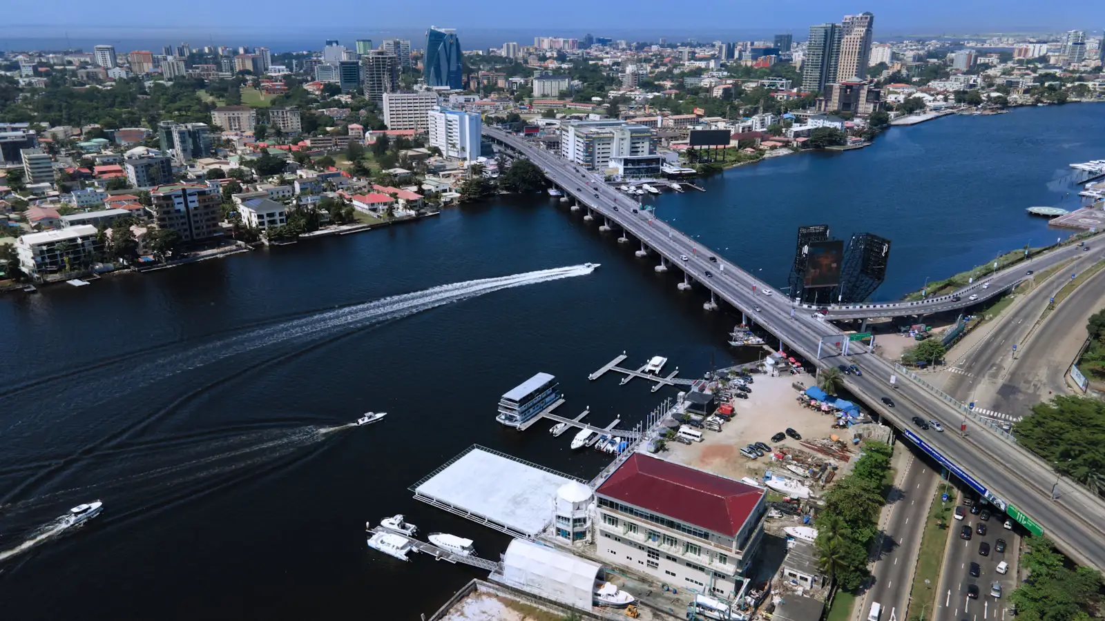 Aerial view of Victoria Island, Lagos, with lagoon boats and the city skyline