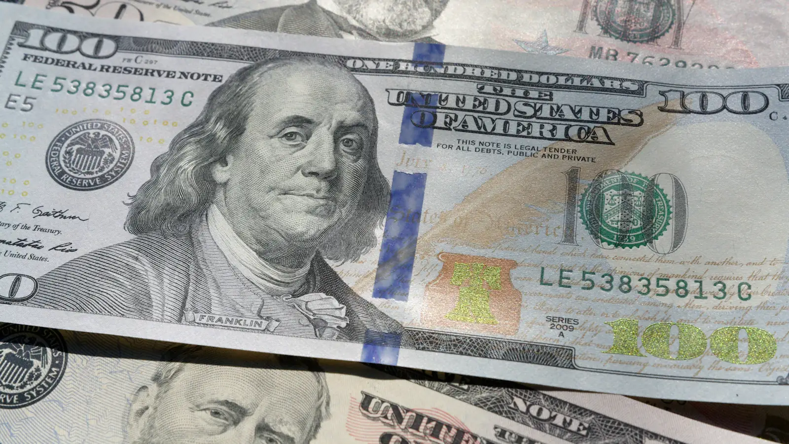 Close-up of a US hundred dollar bill, the dollar backing new stablecoins like PYUSD and RLUSD