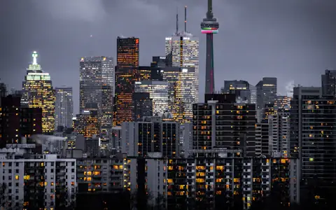 CN Tower and illuminated Toronto skyline at dusk, home of Canada's leading fintech companies