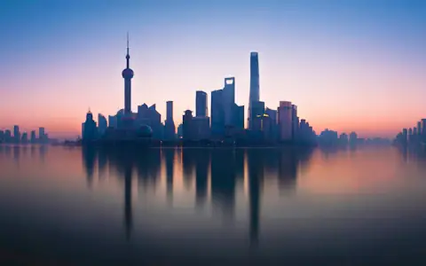 Lujiazui skyline reflected in the Huangpu River, Shanghai, China's financial hub