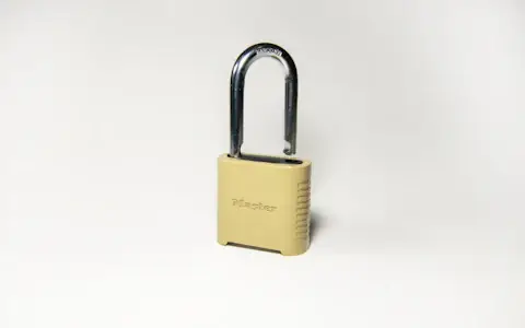 Gold padlock on a clean white surface symbolising secure self-custody of stablecoin holdings