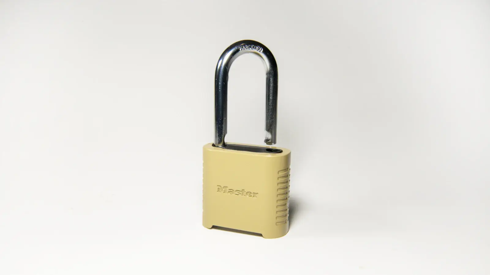 Gold padlock on a clean white surface symbolising secure self-custody of stablecoin holdings