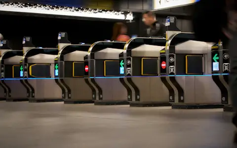Ticket gates in a modern subway station, where contactless and NCMC cards pay fares