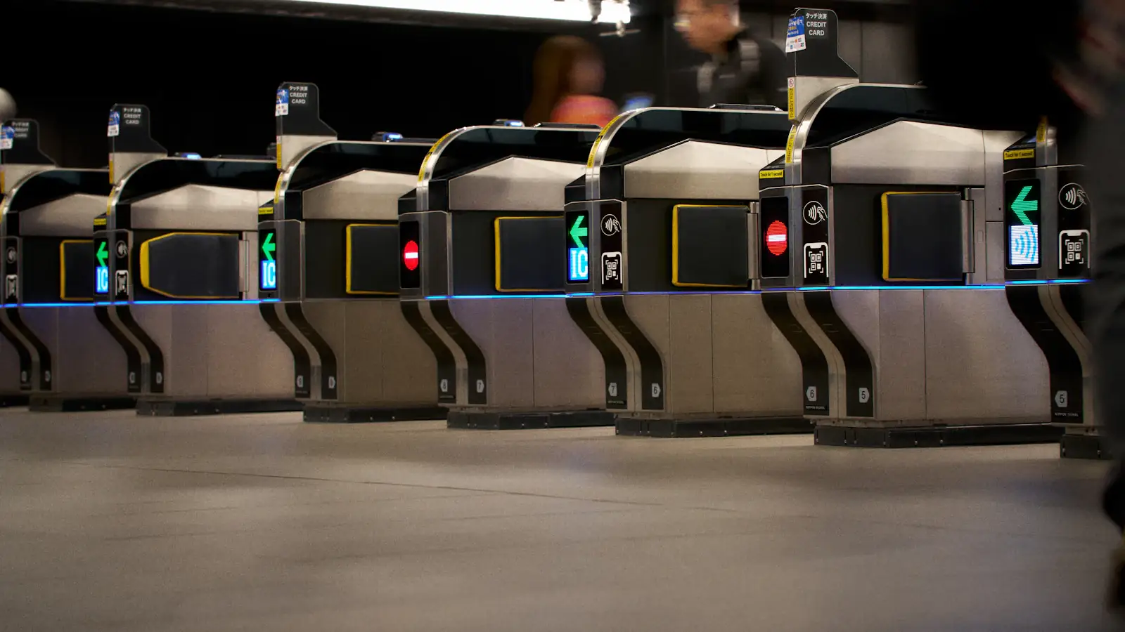 Ticket gates in a modern subway station, where contactless and NCMC cards pay fares