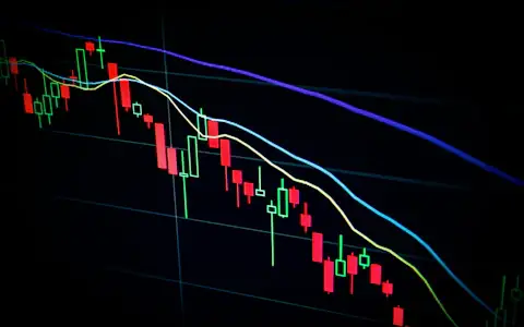 Candlestick price chart on a dark trading screen showing stablecoin and crypto market data