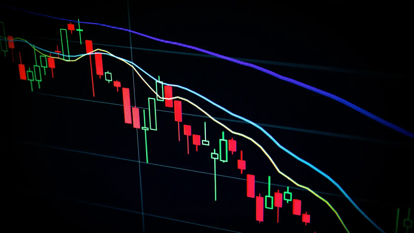 Candlestick price chart on a dark trading screen showing stablecoin and crypto market data