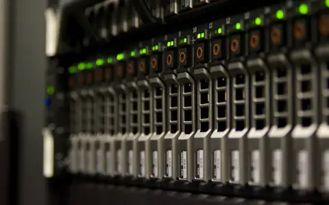 Server rack with blinking green lights, infrastructure powering the largest crypto companies