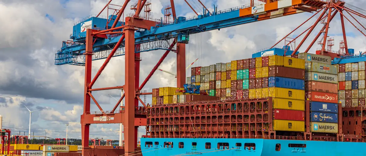 Container ship docked at the port of Hamburg, cargo moving through international business payments