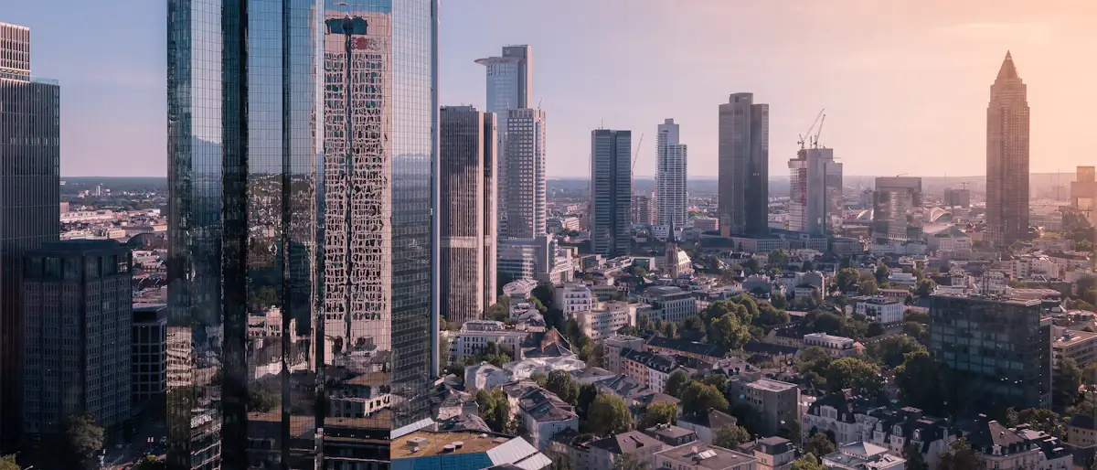 Frankfurt banking towers seen from above under a white sky, home to Europe's major financial companies