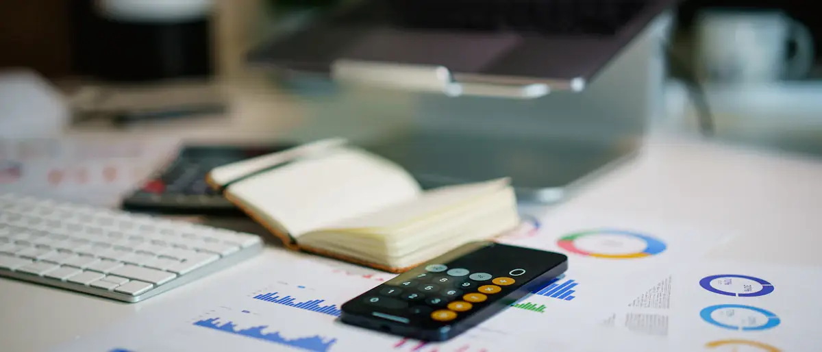 Office desk with a smartphone and printed financial charts used for market research analysis