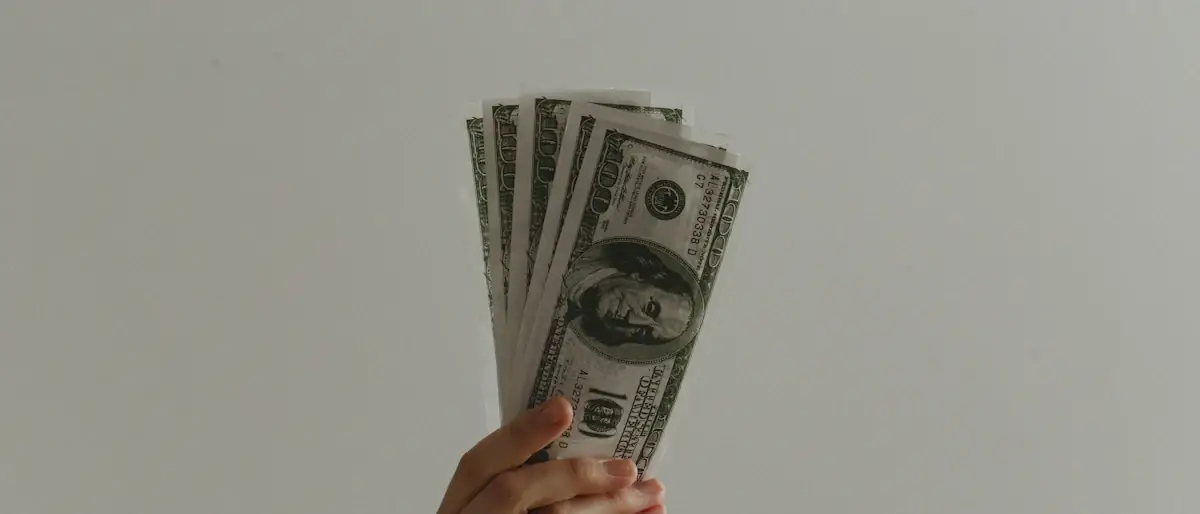 Close-up of a 100 US dollar banknote, the reserve asset behind dollar-backed stablecoins