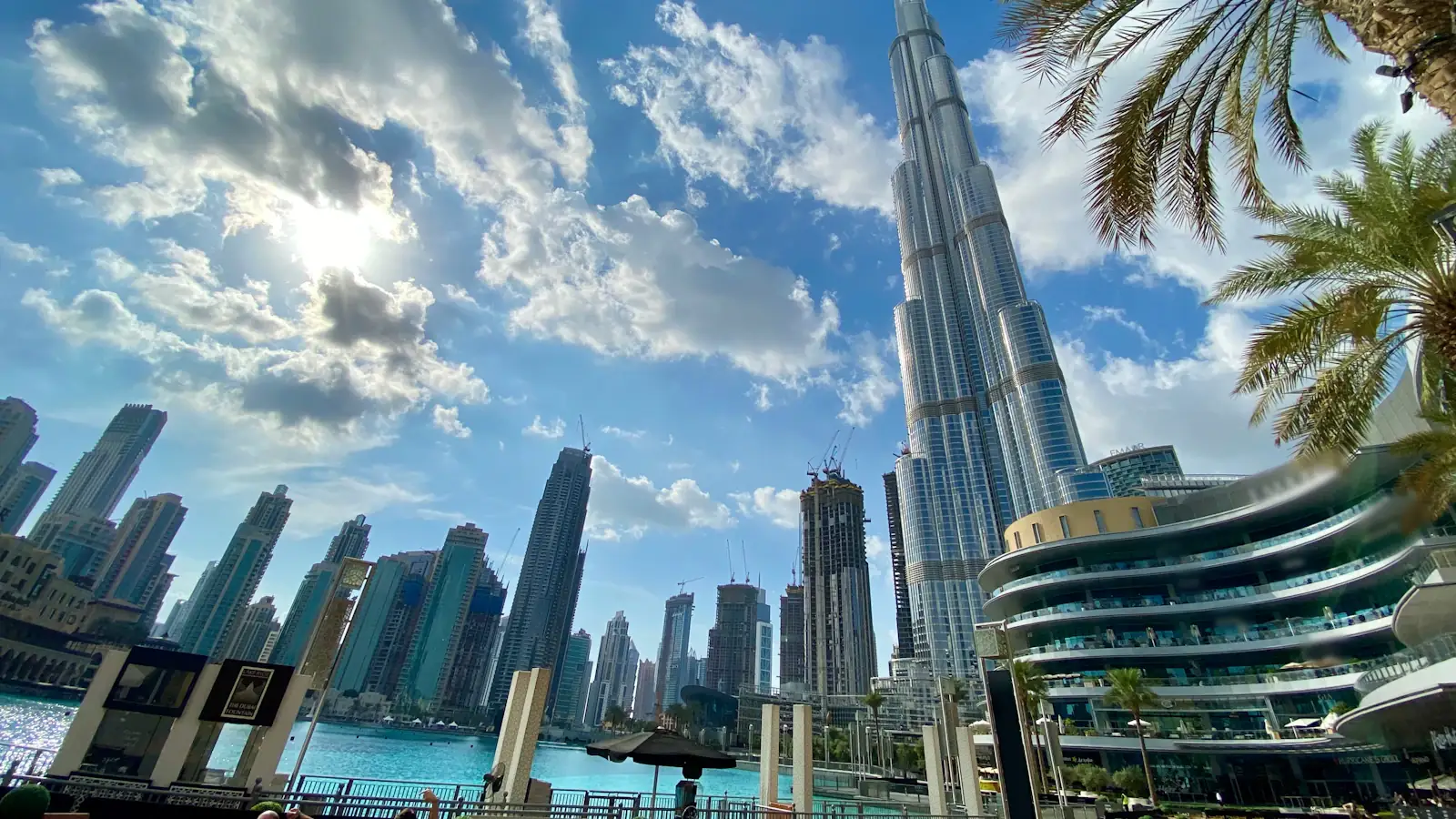 White high-rise towers beside the water in Dubai, a hub for UAE virtual asset regulators
