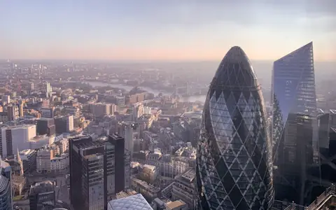 London skyline with the Gherkin and River Thames in low golden sun, UK remittance corridor