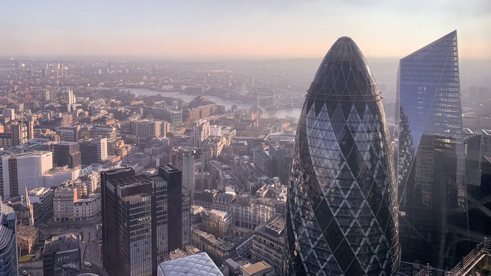 London skyline with the Gherkin and River Thames in low golden sun, UK remittance corridor