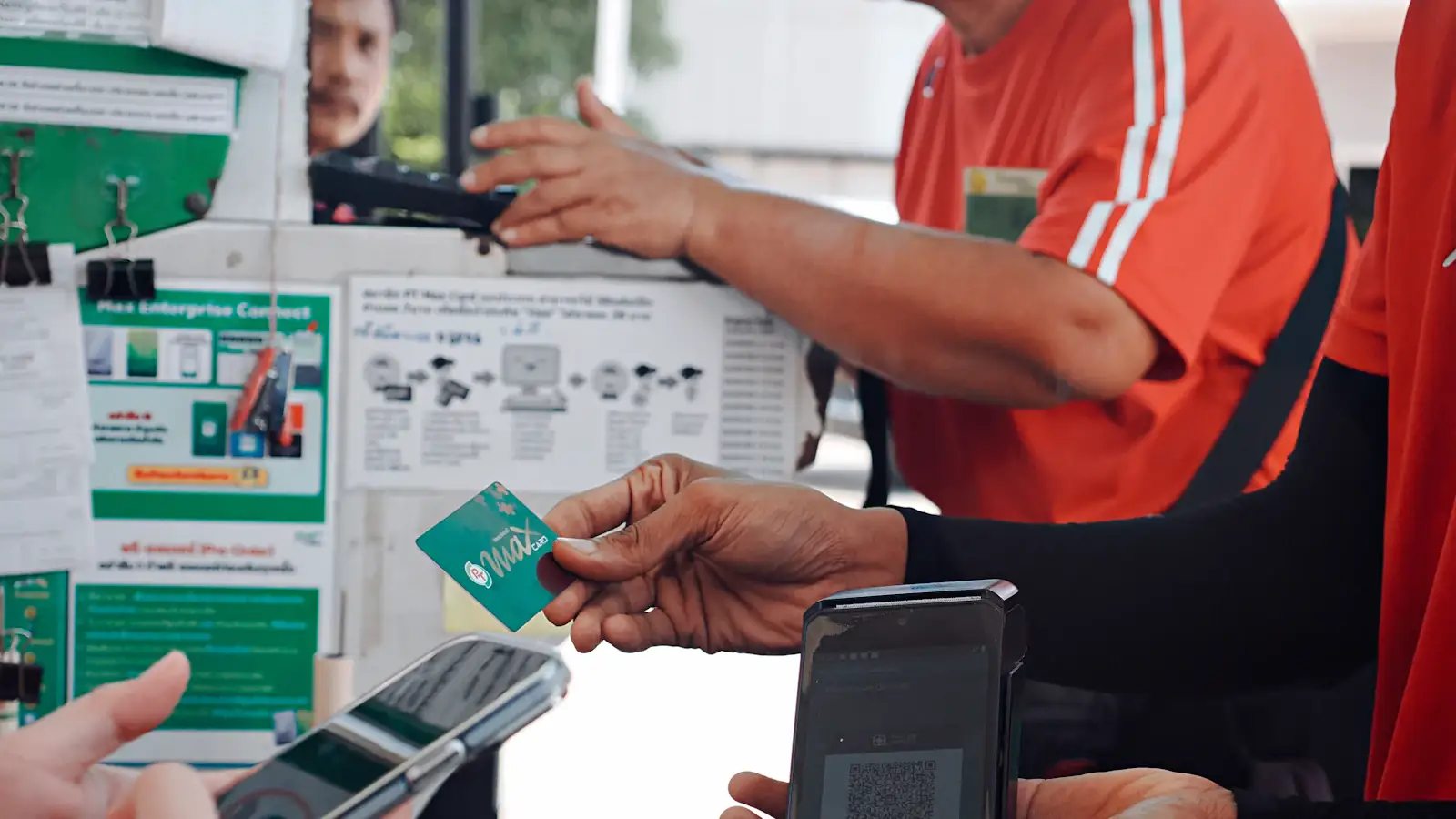 Customer paying with a smartphone at a checkout counter, a moment UPI aims to own globally