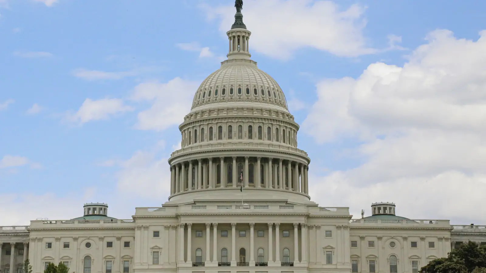 United States Capitol building under a bright blue sky, where crypto market structure law is written