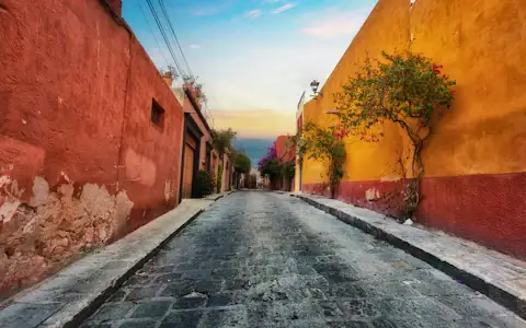 Colourful houses lining a street in Mexico, where US remittances support families