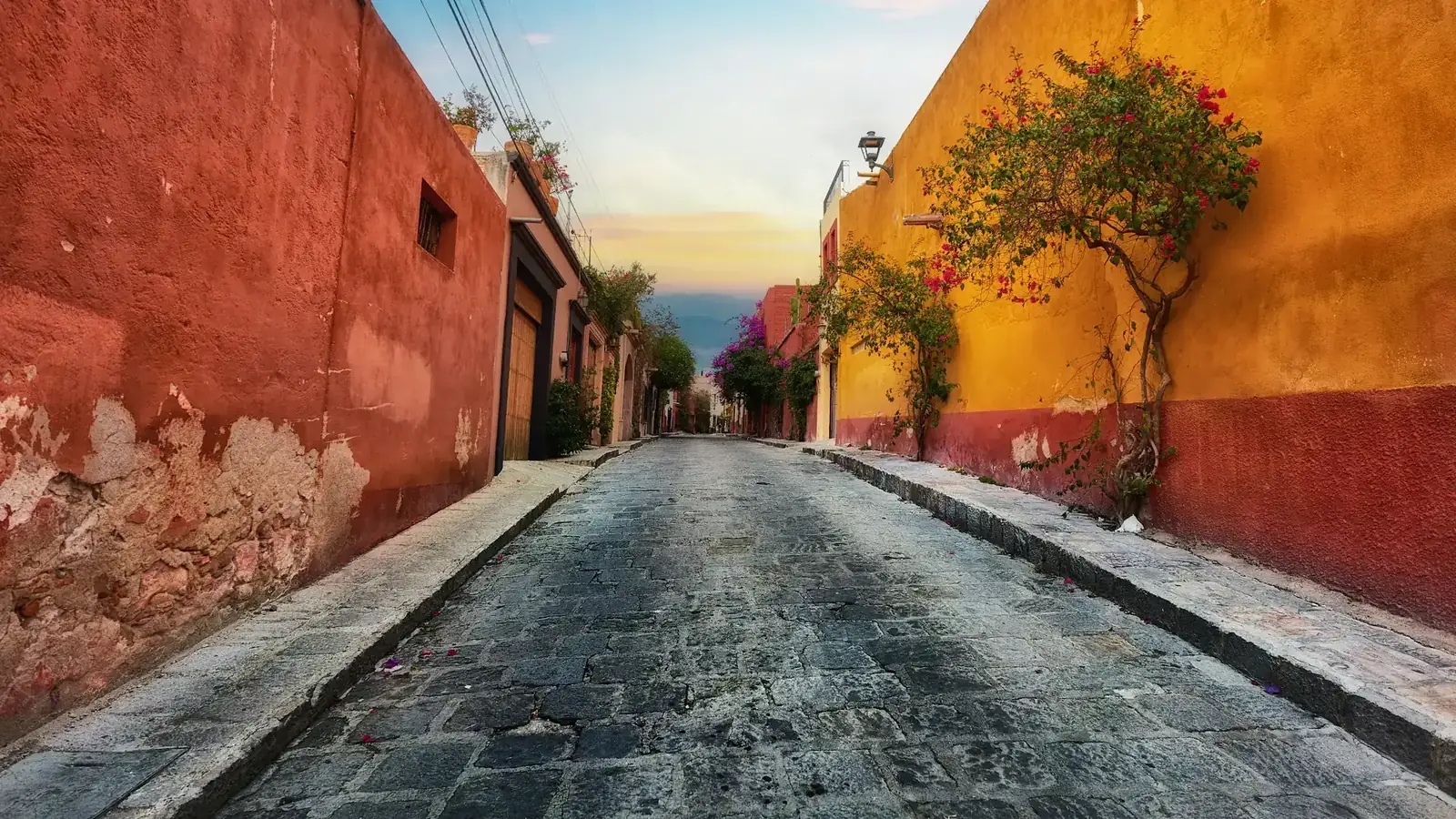 Colourful houses lining a street in Mexico, where US remittances support families