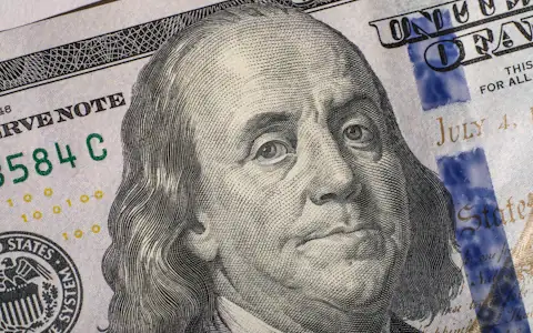 Close-up of a United States hundred dollar bill, the asset behind USDT and USDC