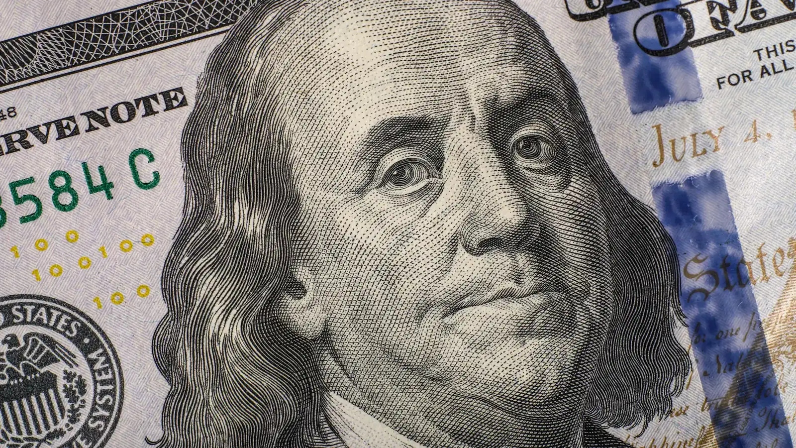 Close-up of a United States hundred dollar bill, the asset behind USDT and USDC