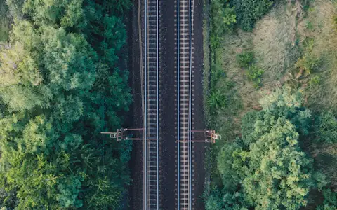 Aerial view of parallel train tracks, a picture of how payment rails work