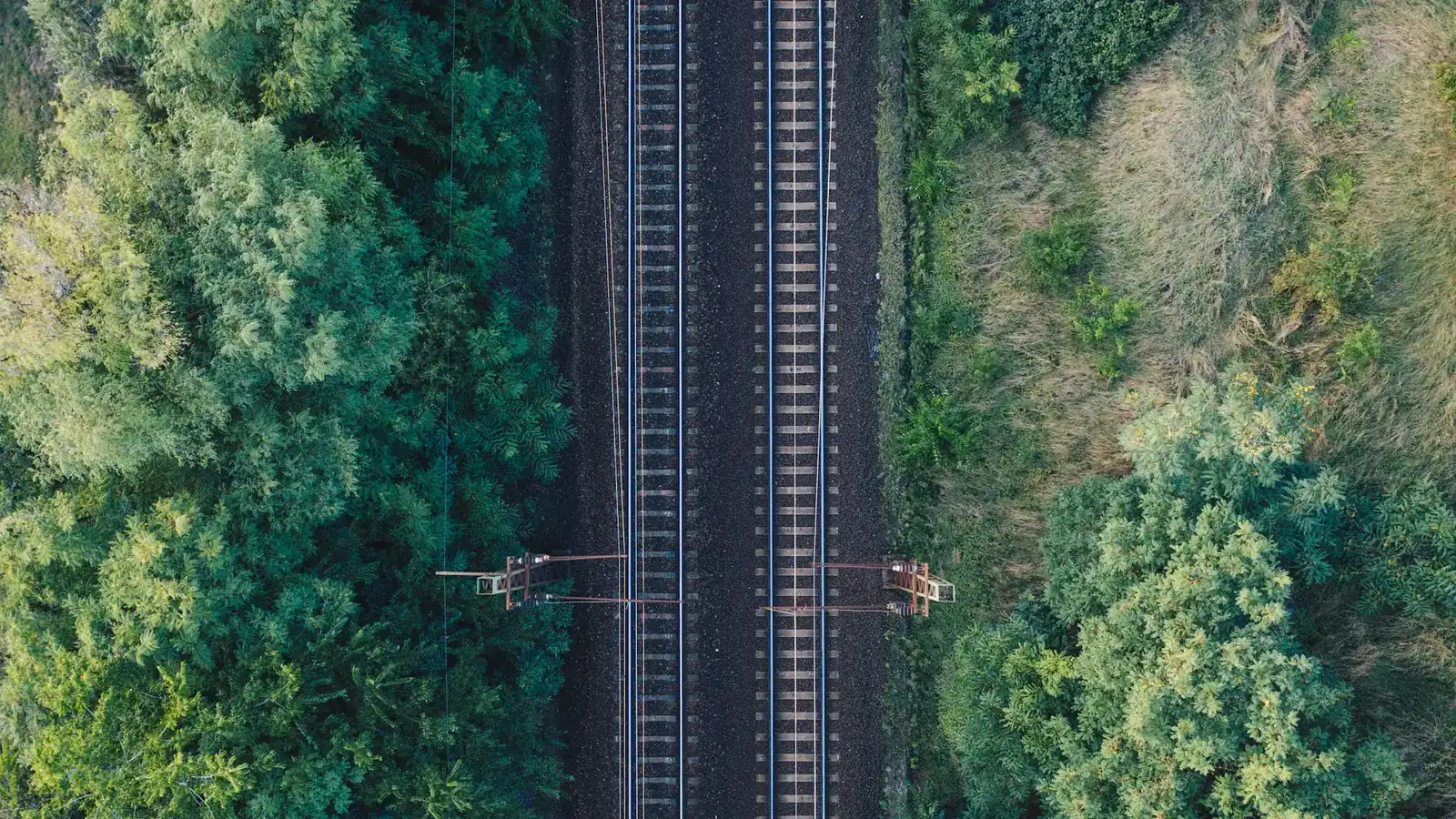 Aerial view of parallel train tracks, a picture of how payment rails work