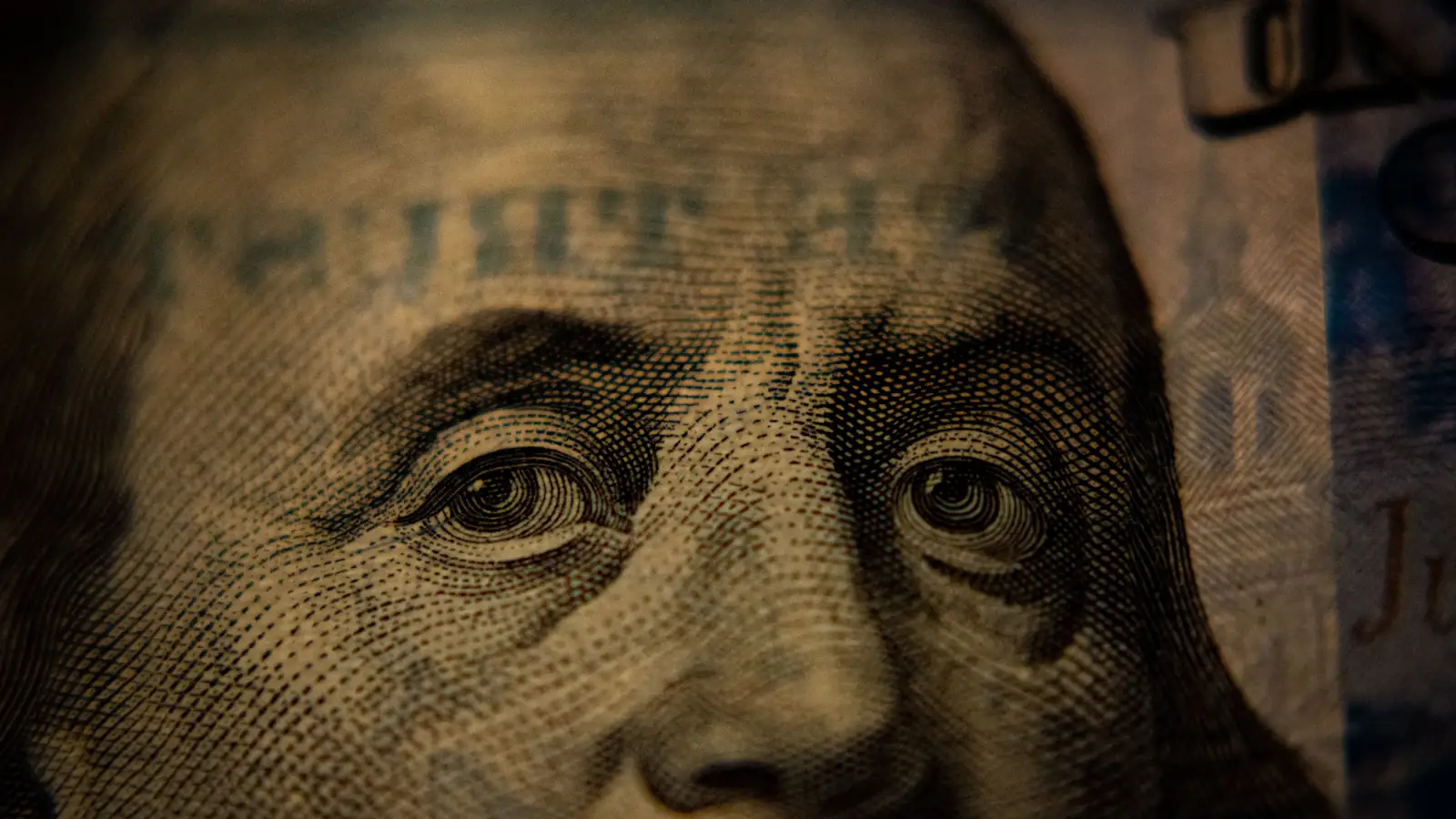Benjamin Franklin portrait on a US hundred dollar bill, the dollar behind stablecoins