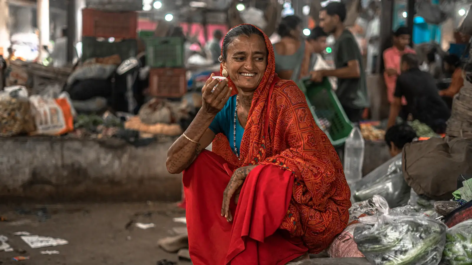 Indian woman talking on her mobile phone, keeping in touch with family abroad