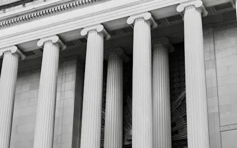 Classical stone ionic columns on a financial building facade