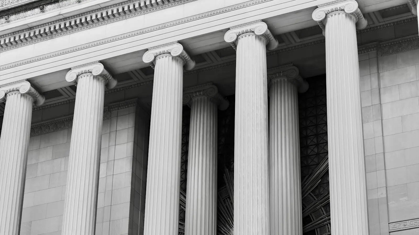 Classical stone ionic columns on a financial building facade